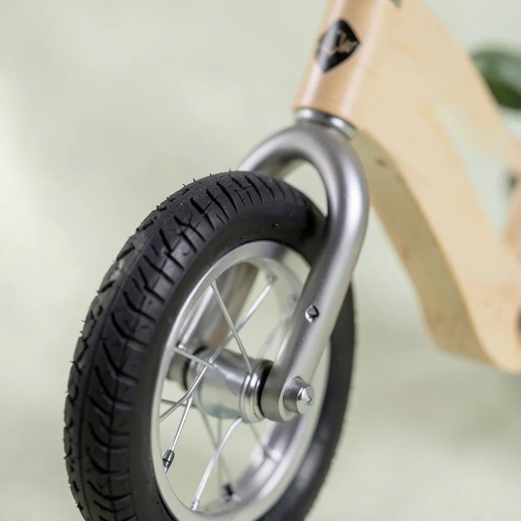Close-up of the Pathfinder Balance Bike 12" balance bike with birch frame
